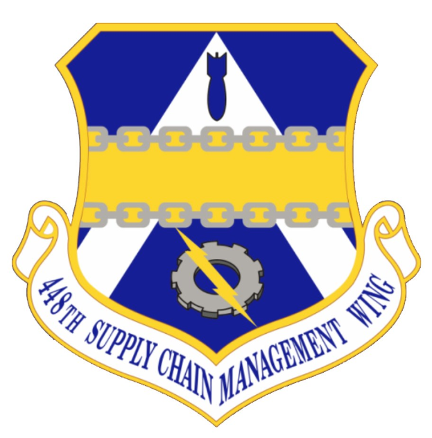 Logo des 48. Versorgungsgeschwader mit einem blauen Schild mit einem weißen Stern, einem weißen Banner mit der Aufschrift "Versorgungsgeschwader" in blau und dem Text "48. Versorgungsgeschwader" in schwarz.