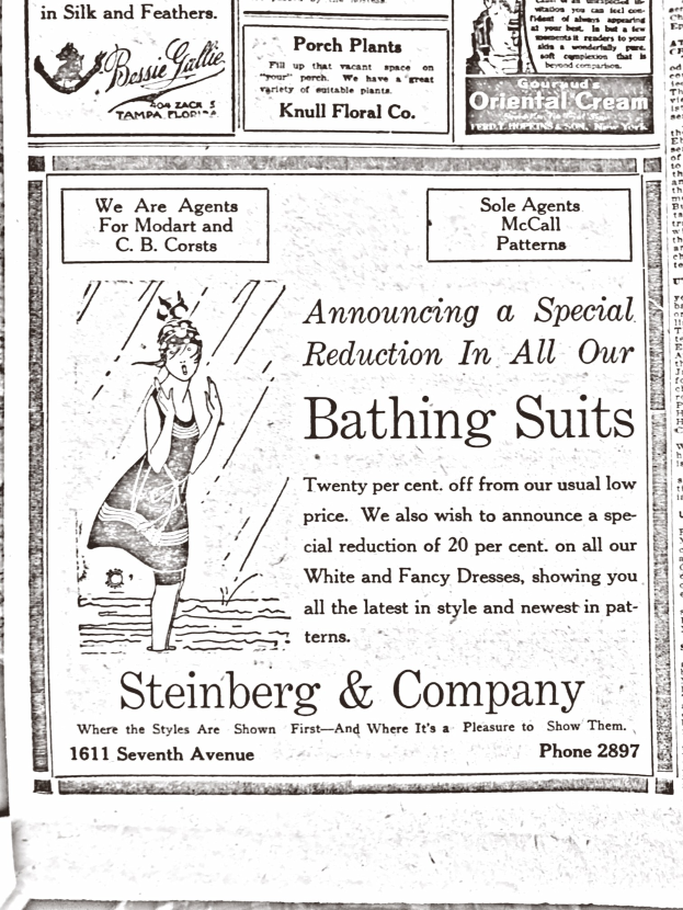 Eine Frau in einem weißen Rollkragenpullover und langärmeligem Kleid mit einem Dutt, die friedlich in der Mitte einer Werbung für Steinberg & Company-Badeanzüge posiert, umgeben von Text.