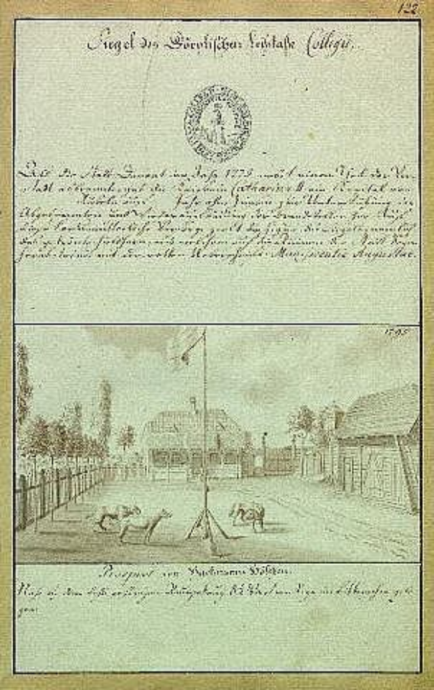 Schwarz-weißes Bild einer Kopie der ersten Fassung der deutschen Verfassung, das eine Straßen Szene mit einem Fahnenmast, Gebäuden, Bäumen und Himmel zeigt.